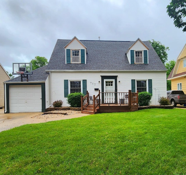 717 2nd Ave SW, Pipestone, MN 56164 - cape cod house featuring a front yard, driveway, a garage, and a shingled roof