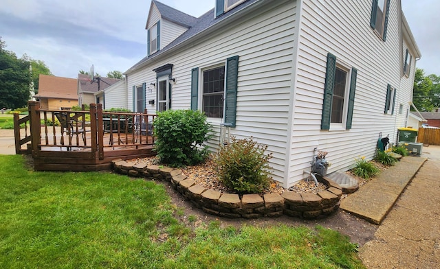 717 2nd Ave SW, Pipestone, MN 56164 - view of side of property with a wooden deck and a yard
