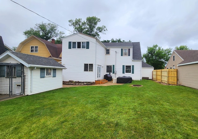717 2nd Ave SW, Pipestone, MN 56164 - back of property with an outdoor structure and a shingled roof