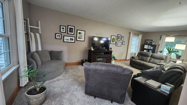 717 2nd Ave SW, Pipestone, MN 56164 - living room with carpet floors and a fireplace