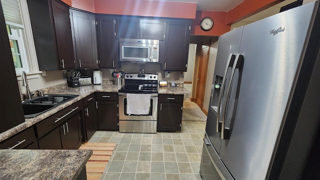 717 2nd Ave SW, Pipestone, MN 56164 - kitchen with appliances with stainless steel finishes and light tile patterned floors