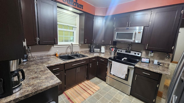 717 2nd Ave SW, Pipestone, MN 56164 - kitchen featuring stainless steel electric range oven and a sink