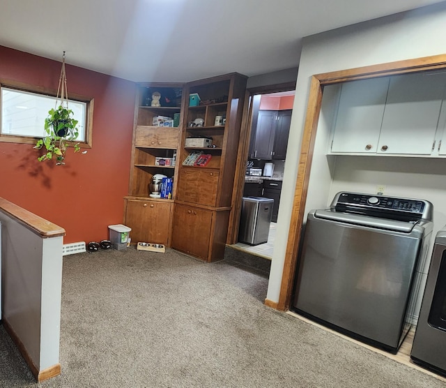 717 2nd Ave SW, Pipestone, MN 56164 - kitchen with washer and dryer, light colored carpet, and a baseboard heating unit
