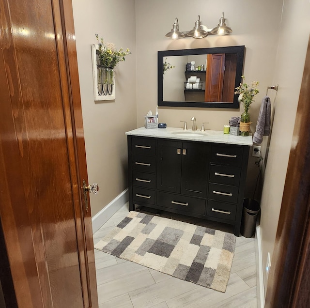 717 2nd Ave SW, Pipestone, MN 56164 - bathroom with vanity and baseboards