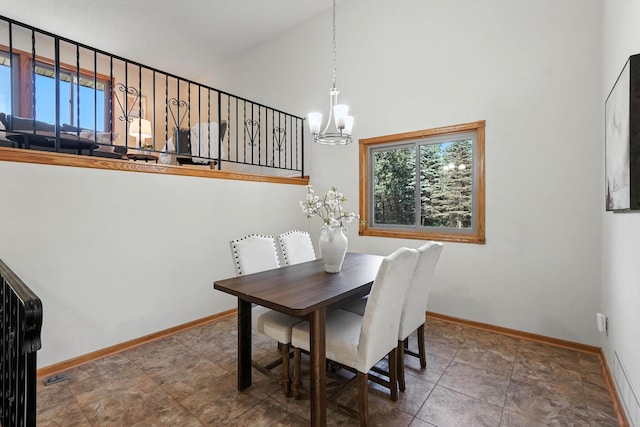 14226 310th Ave, Princeton, MN 55371 - dining space featuring a chandelier, plenty of natural light, and a high ceiling