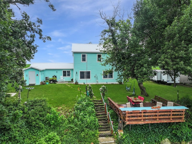 34 Shady Rest Rd, Lake Sarah Twp, MN 56132 - rear view of house featuring a yard, a metal roof, a wooden deck, and stairs