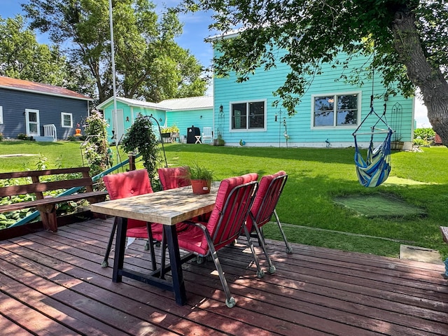 34 Shady Rest Rd, Lake Sarah Twp, MN 56132 - deck featuring a yard, outdoor dining space, and an outbuilding