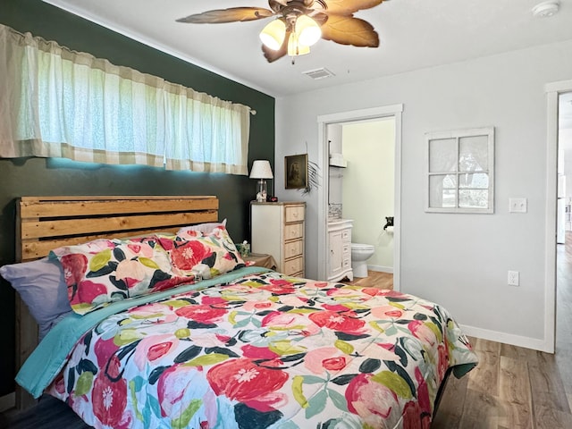 34 Shady Rest Rd, Lake Sarah Twp, MN 56132 - bedroom featuring multiple windows, light wood-style flooring, connected bathroom, and a ceiling fan