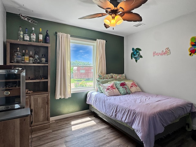 34 Shady Rest Rd, Lake Sarah Twp, MN 56132 - bedroom featuring wood finished floors and a ceiling fan