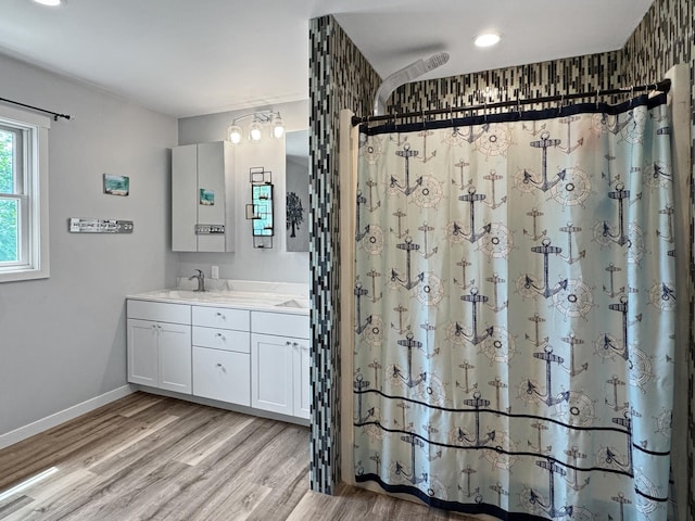 34 Shady Rest Rd, Lake Sarah Twp, MN 56132 - bathroom featuring double vanity, wood finished floors, a shower with curtain, and recessed lighting