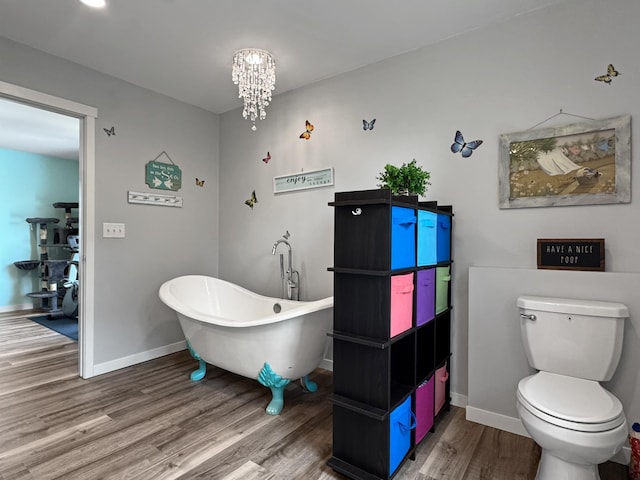 34 Shady Rest Rd, Lake Sarah Twp, MN 56132 - full bathroom featuring wood finished floors, a freestanding bath, and a chandelier