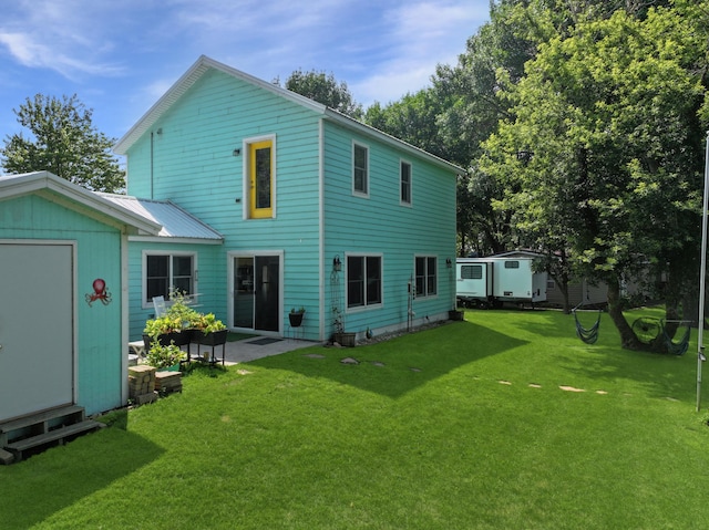 34 Shady Rest Rd, Lake Sarah Twp, MN 56132 - back of property with a lawn, a shed, and a patio