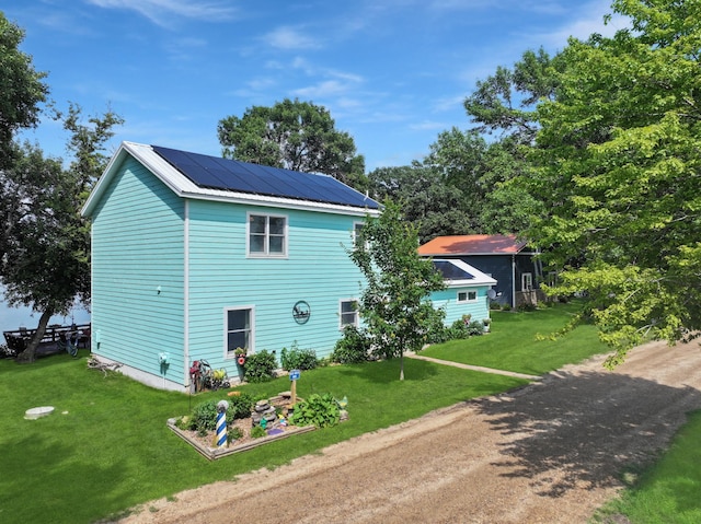 34 Shady Rest Rd, Lake Sarah Twp, MN 56132 - view of home's exterior featuring solar panels and a yard