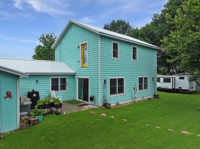 34 Shady Rest Rd, Lake Sarah Twp, MN 56132 - back of house featuring a patio, a lawn, and a metal roof