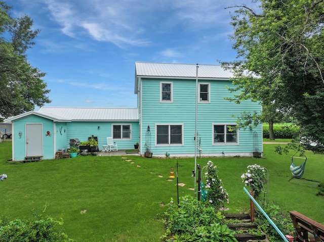 34 Shady Rest Rd, Lake Sarah Twp, MN 56132 - rear view of property with a metal roof, a lawn, a storage shed, and a patio area