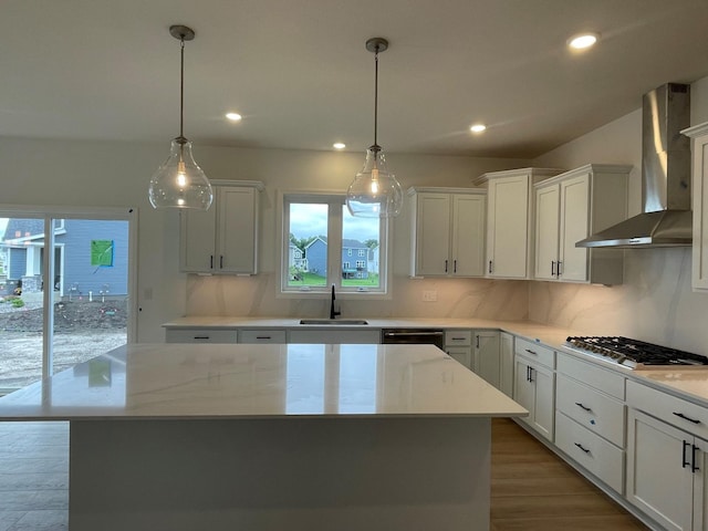 7945 Jade Ln, Victoria, MN 55386 - kitchen with wall chimney exhaust hood, stainless steel appliances, plenty of natural light, wood finished floors, and recessed lighting
