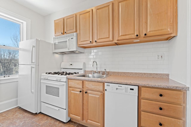 2218 Nicollet Ave Unit 22, Minneapolis, MN 55404 - kitchen featuring white appliances, light brown cabinets, healthy amount of natural light, and light countertops