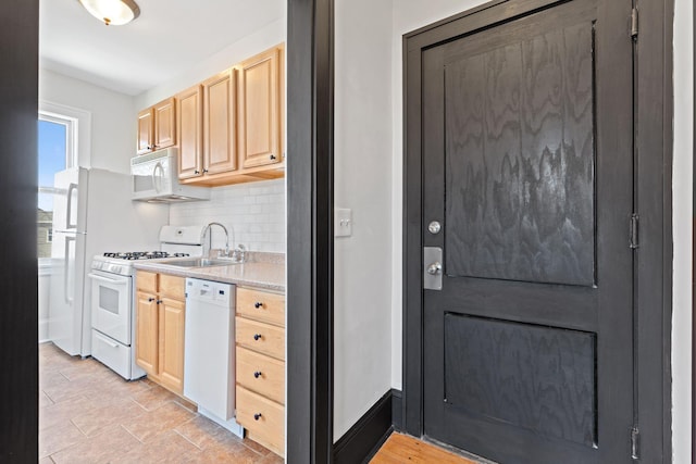 2218 Nicollet Ave Unit 22, Minneapolis, MN 55404 - kitchen with white appliances, light brown cabinetry, backsplash, and light countertops