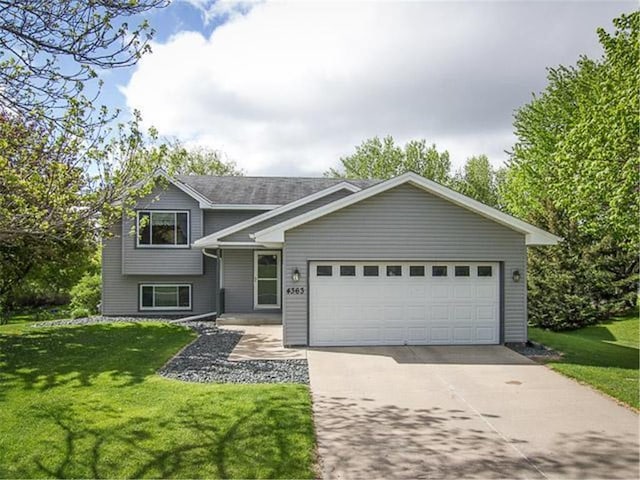 4363 145th St, Savage, MN 55378 - tri-level home with a garage, a front yard, and concrete driveway