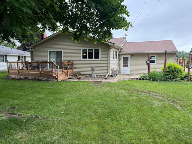 1204 Garflield Ave, Albert Lea, MN 56007 - rear view of house featuring a deck, a lawn, and roof with shingles