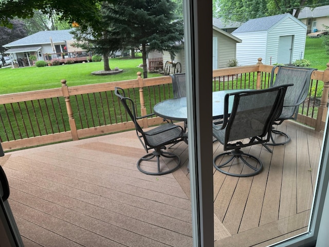1204 Garflield Ave, Albert Lea, MN 56007 - wooden deck with a lawn and an outbuilding