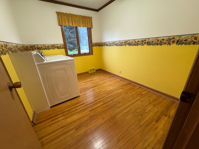 1204 Garflield Ave, Albert Lea, MN 56007 - spare room with light wood-style flooring and ornamental molding