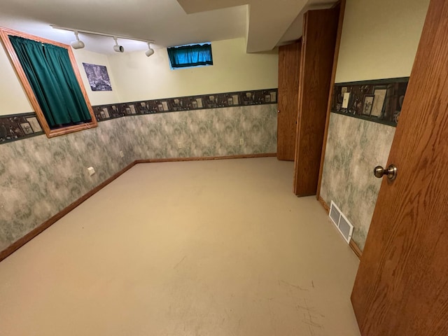 1204 Garflield Ave, Albert Lea, MN 56007 - finished below grade area featuring wallpapered walls, wainscoting, and track lighting