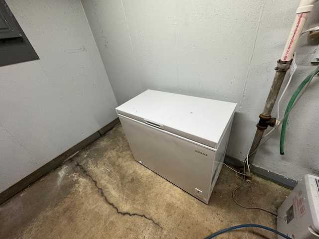 1204 Garflield Ave, Albert Lea, MN 56007 - detailed view of unfinished concrete flooring and fridge