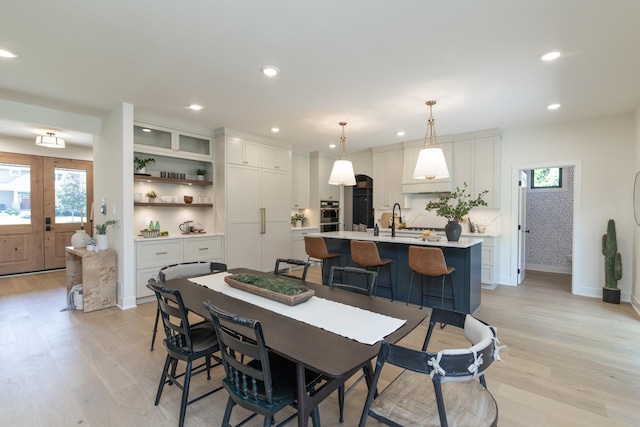 625 Ivy Falls Ave, Mendota Heights, MN 55118 - dining space featuring healthy amount of natural light, light wood finished floors, recessed lighting, and french doors