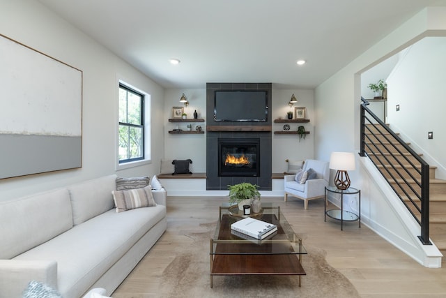 625 Ivy Falls Ave, Mendota Heights, MN 55118 - living area featuring stairs, a large fireplace, wood finished floors, and recessed lighting