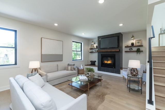 625 Ivy Falls Ave, Mendota Heights, MN 55118 - living area with wood finished floors, stairway, a fireplace, and recessed lighting