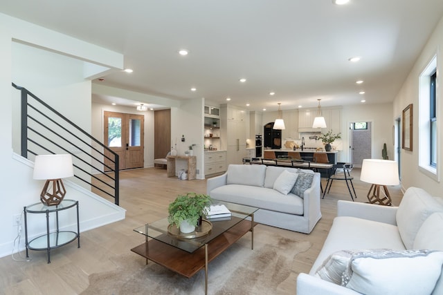 625 Ivy Falls Ave, Mendota Heights, MN 55118 - living area with stairs, light wood finished floors, and recessed lighting