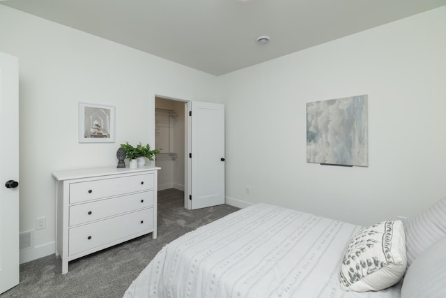 625 Ivy Falls Ave, Mendota Heights, MN 55118 - bedroom featuring dark colored carpet and a walk in closet