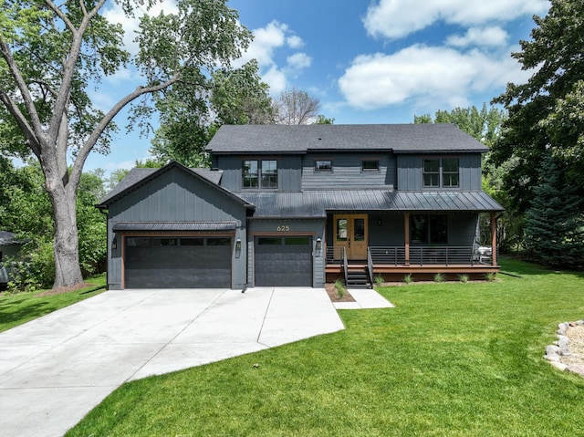 625 Ivy Falls Ave, Mendota Heights, MN 55118 - view of front of house featuring concrete driveway, covered porch, a standing seam roof, a front yard, and a metal roof
