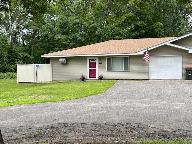 15965 Red Sand Cir, Brainerd, MN 56401 - ranch-style home featuring an attached garage, a front lawn, driveway, and a shingled roof
