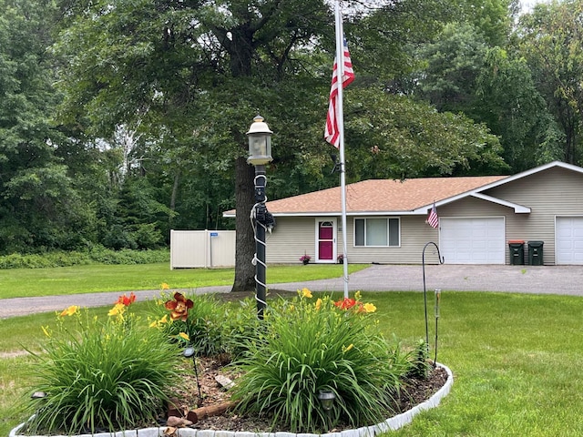15965 Red Sand Cir, Brainerd, MN 56401 - view of front of home with an attached garage, a front lawn, driveway, and a shingled roof