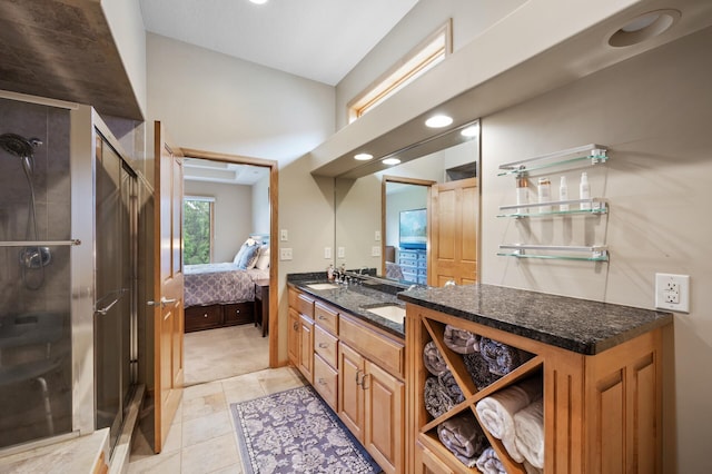 11880 Dunkirk Cir NE, Blaine, MN 55449 - full bathroom featuring connected bathroom, a stall shower, double vanity, tile patterned floors, and recessed lighting