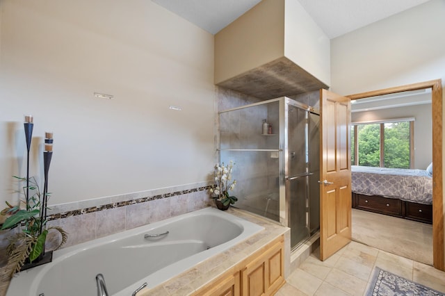11880 Dunkirk Cir NE, Blaine, MN 55449 - full bathroom with a bath, tile patterned flooring, and a stall shower