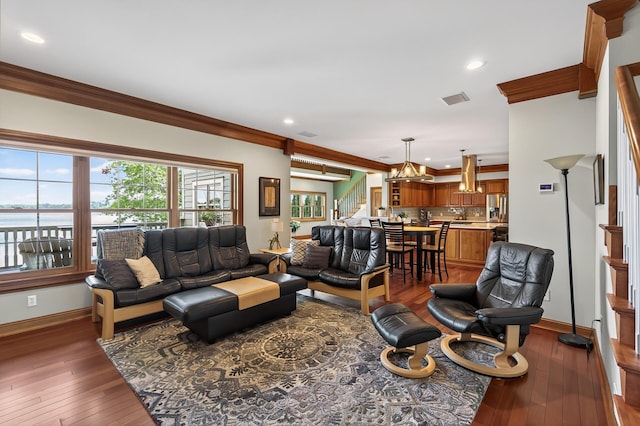 7471 260th St, Wyoming, MN 55092 - living room with stairs, ornamental molding, a chandelier, hardwood / wood-style floors, and recessed lighting