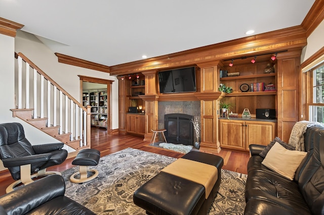 7471 260th St, Wyoming, MN 55092 - living room featuring ornamental molding, a premium fireplace, dark wood-style flooring, and stairway