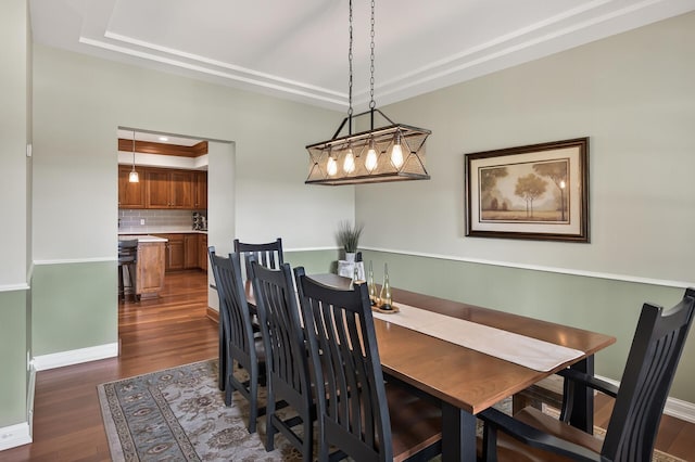 7471 260th St, Wyoming, MN 55092 - dining area featuring a tray ceiling and dark wood-style flooring