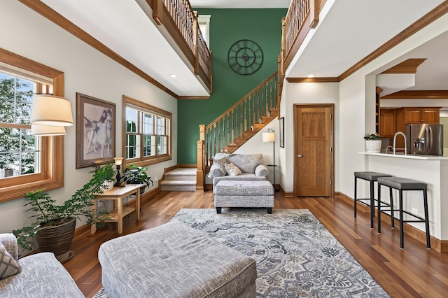 7471 260th St, Wyoming, MN 55092 - living area featuring stairs, crown molding, and wood finished floors