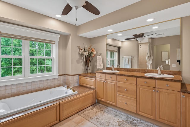 7471 260th St, Wyoming, MN 55092 - full bathroom featuring ceiling fan, double vanity, a whirlpool tub, tile patterned flooring, and recessed lighting