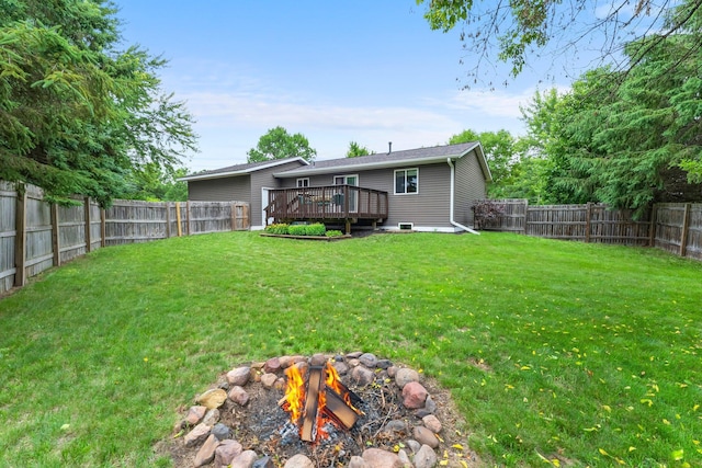 6071 Red Fox Run, North Branch, MN 55056 - fenced backyard with a deck and a fire pit