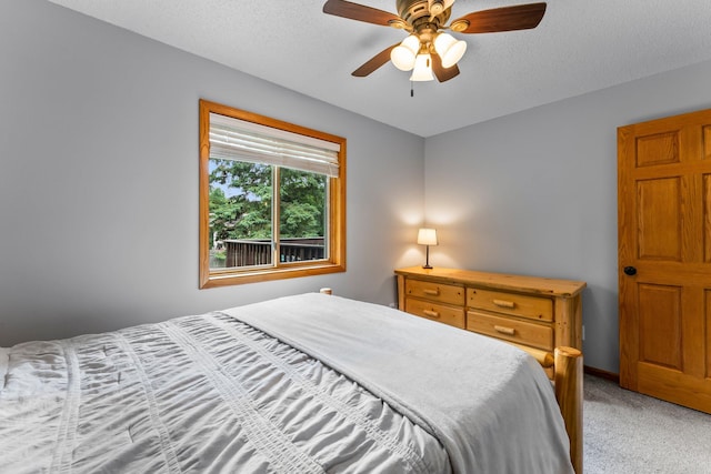 6071 Red Fox Run, North Branch, MN 55056 - bedroom featuring light colored carpet, ceiling fan, and a textured ceiling