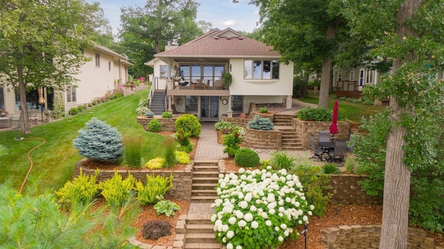 9525 Shore Trl N, Forest Lake, MN 55025 - back of house featuring stairs, stucco siding, and a lawn