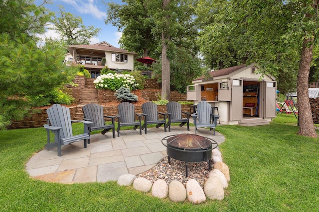 9525 Shore Trl N, Forest Lake, MN 55025 - view of patio featuring an outdoor fire pit and an outbuilding