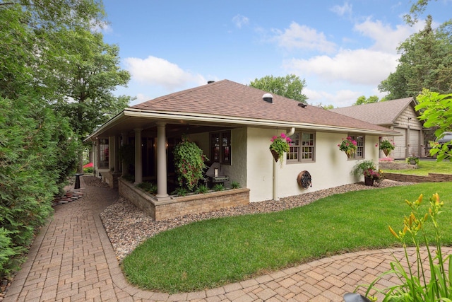 9525 Shore Trl N, Forest Lake, MN 55025 - rear view of property featuring stucco siding, a lawn, and roof with shingles
