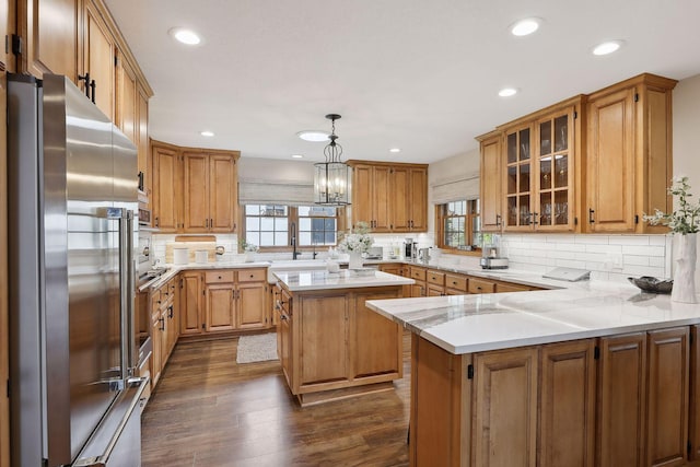 9525 Shore Trl N, Forest Lake, MN 55025 - kitchen featuring stainless steel appliances, healthy amount of natural light, decorative backsplash, a peninsula, and recessed lighting