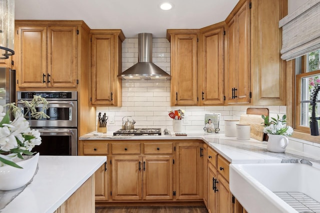 9525 Shore Trl N, Forest Lake, MN 55025 - kitchen featuring appliances with stainless steel finishes, wall chimney exhaust hood, light countertops, and recessed lighting
